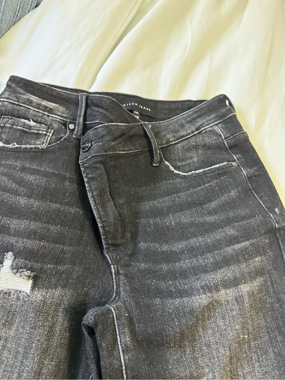 Women’s Skinny Black Washed Jeans with Subtle Distressing Cross over closure